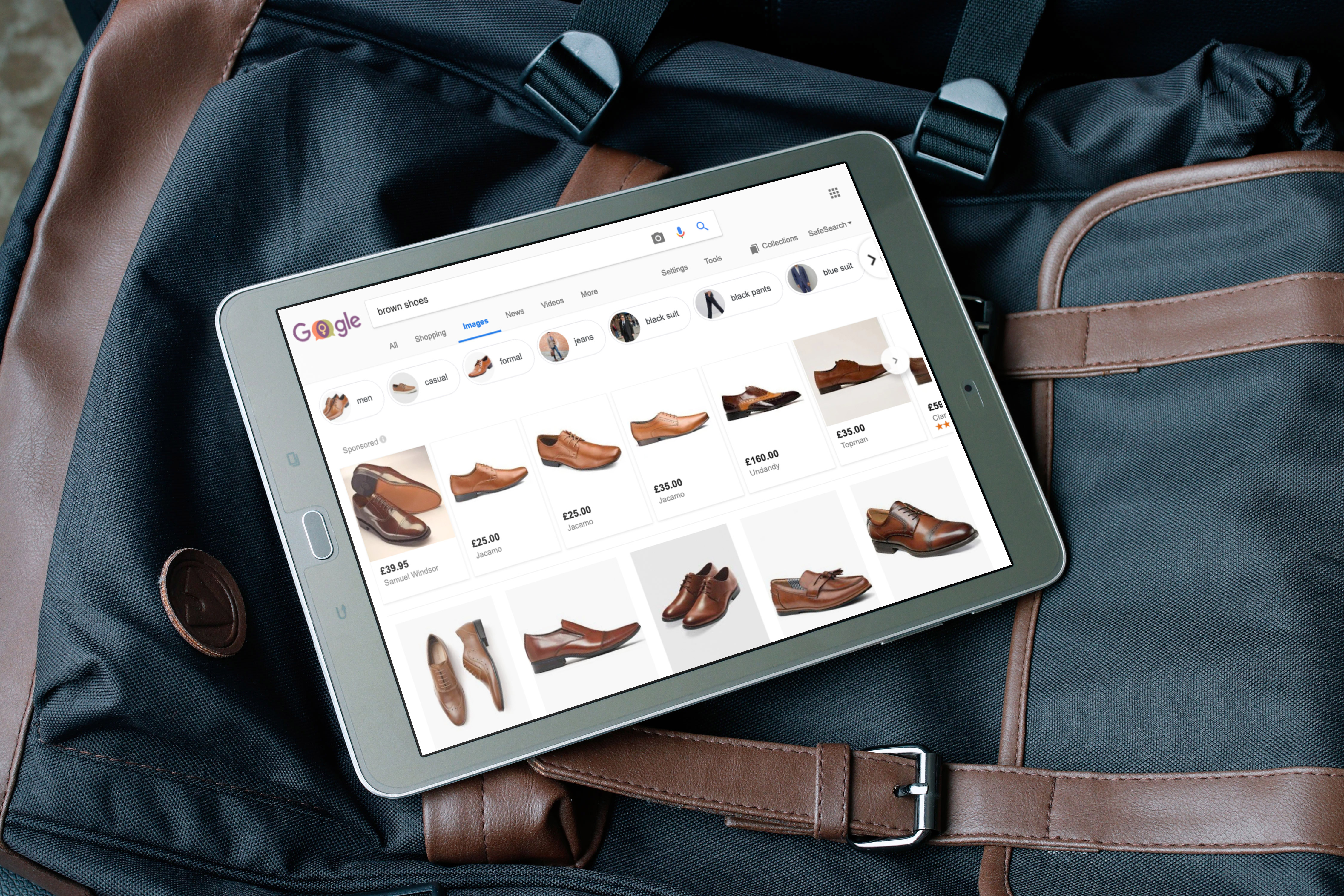 Android tablet displaying brown formal shoes on Google Shopping