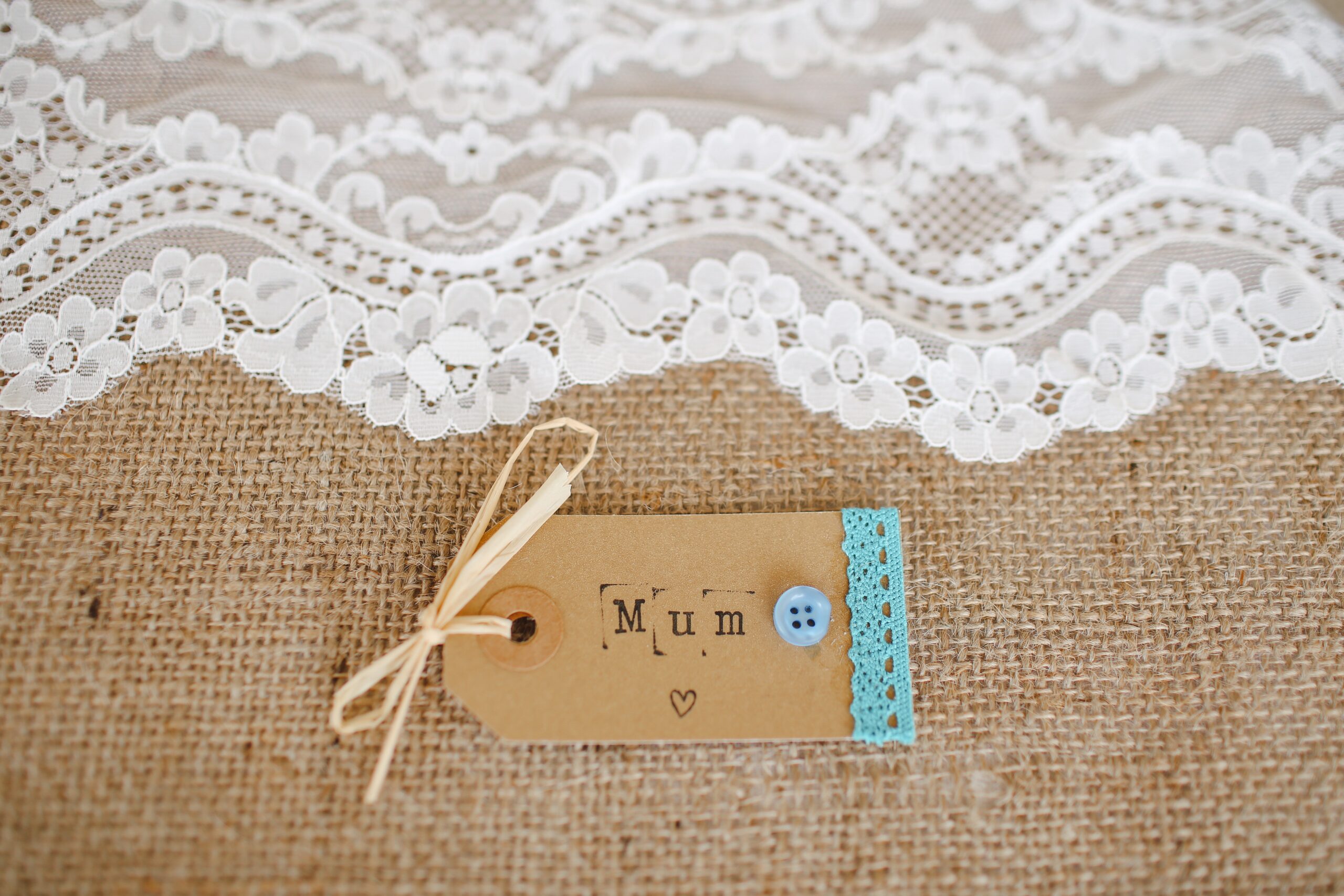 Mother's Day gift tag on fabric surface