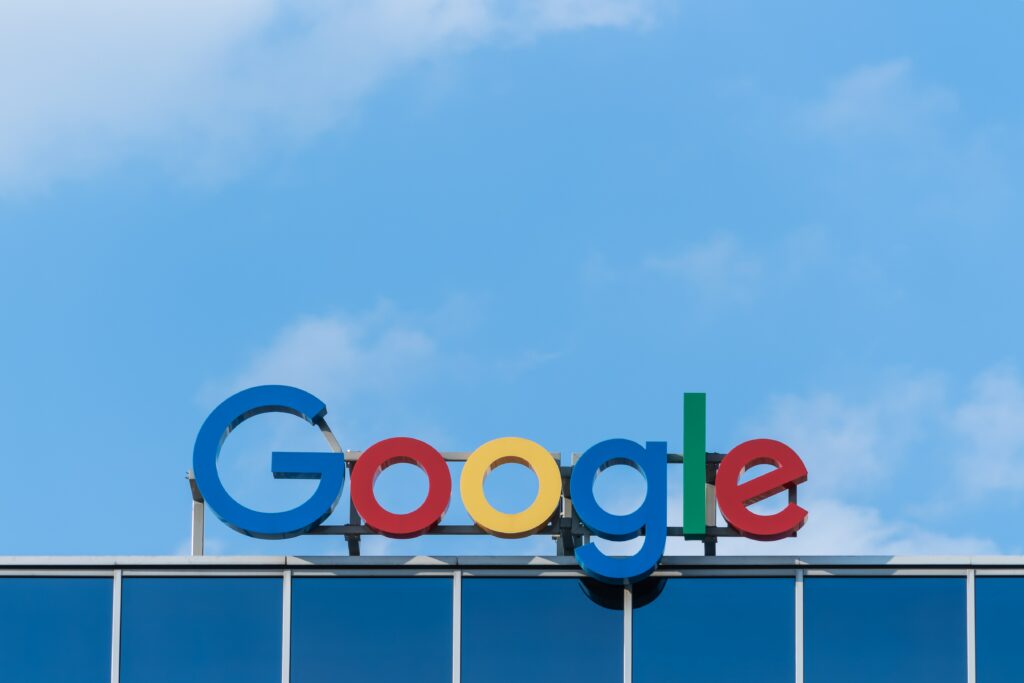 The Google logo, atop a building