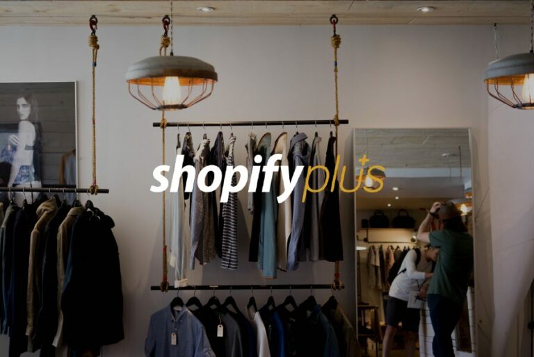 interior of fashion store with Shopify Plus logo in foreground
