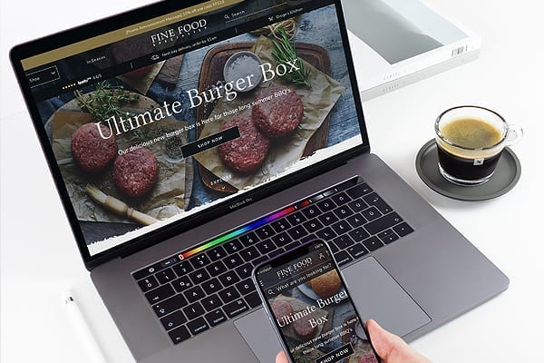 A website on a laptop and mobile background with subtly different designs