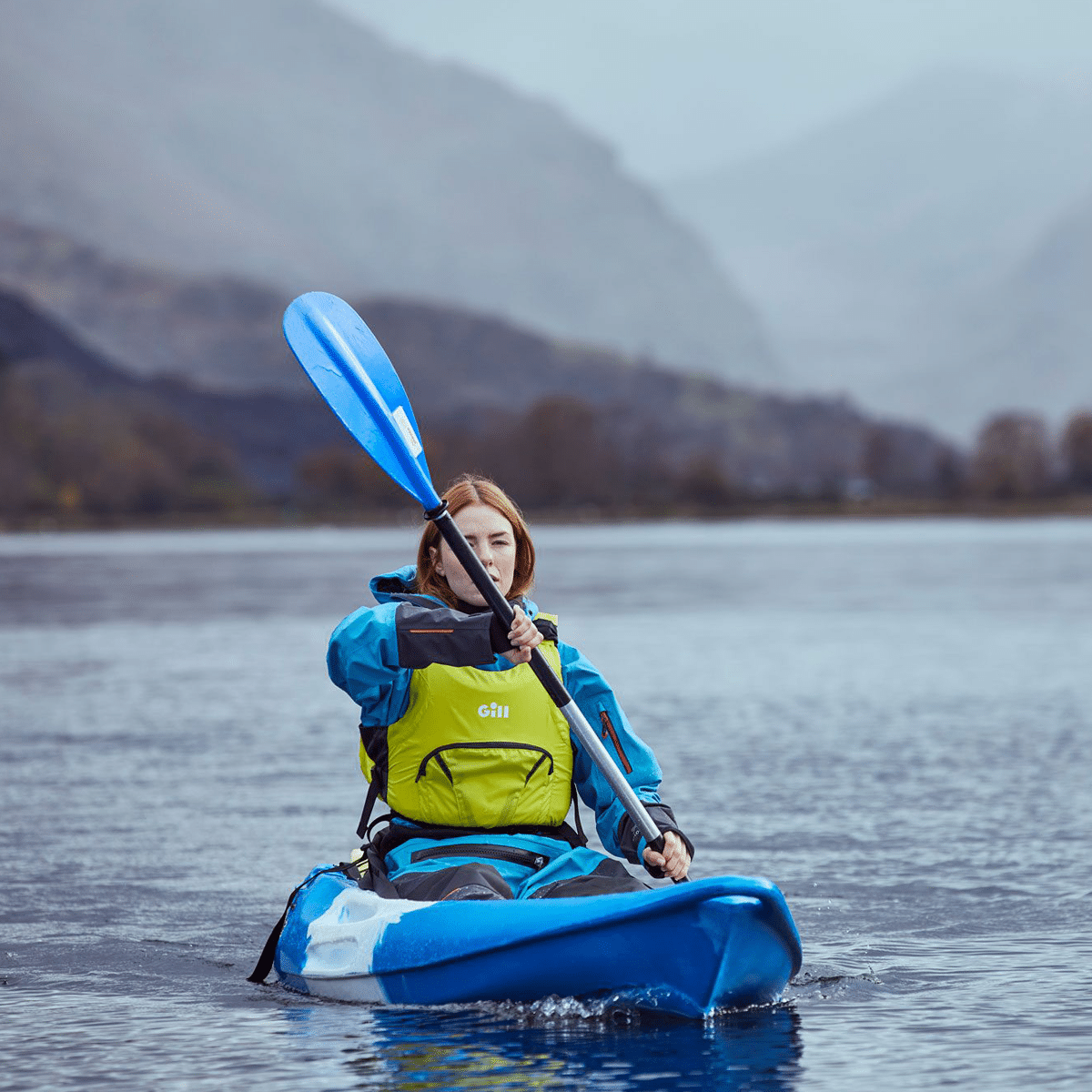 Female wearing Gill sailing wear for paddle sport