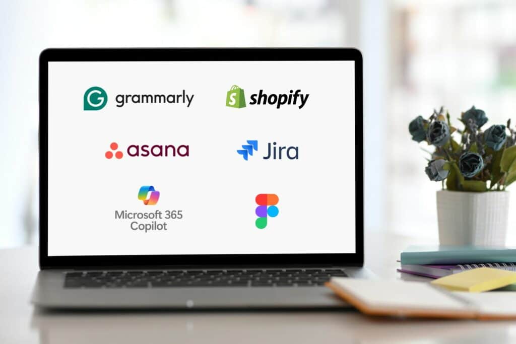 Ai applications like grammarly, figma, asana, jira, shopify ai on laptop